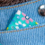 Мягкая игрушка Басик в голубом комбинезоне с цветком 30см - 2 436 руб. в alfabook